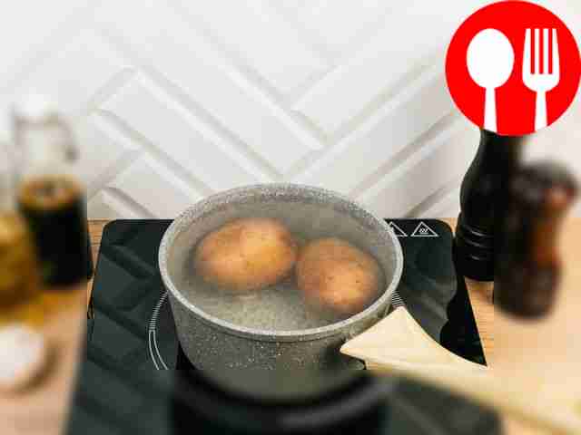 Boil the potatoes in their skins and cool them.