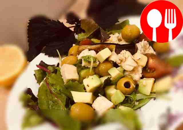 Serve the chicken and arugula on a plate lined...