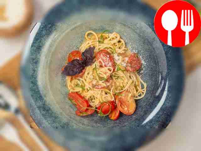 Place spaghetti with cherry tomatoes on wide...