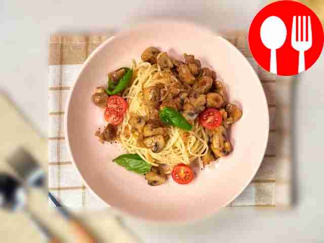 Garnish the pasta with mushrooms with herbs...