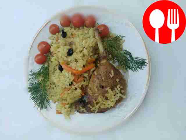 Pilaf with duck in a frying pan
