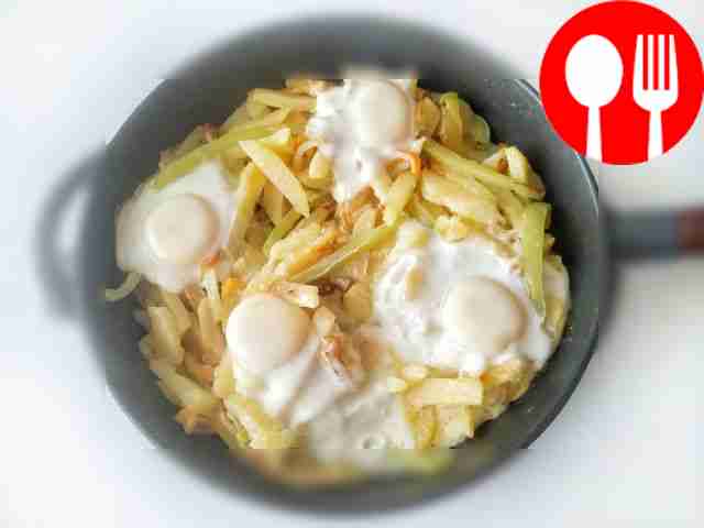 Serve scrambled eggs with potatoes, garnished...