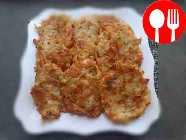 Serve the potato pancakes on a plate, placing...