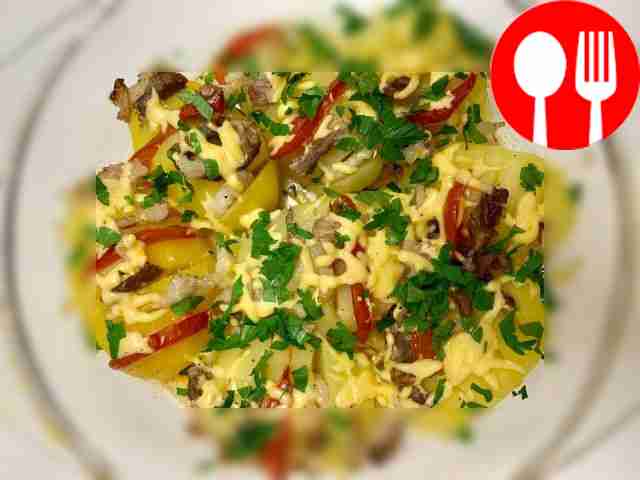 Baked accordion potatoes with lard and tomato