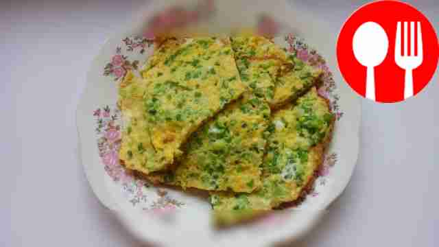 Eggs with fresh herbs in a frying pan