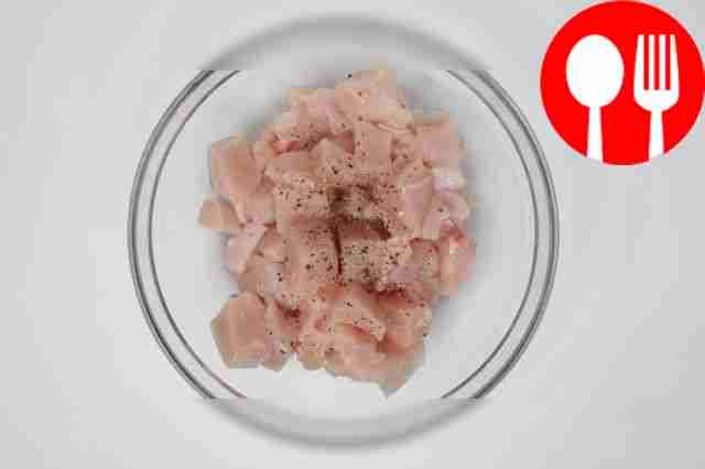 Cut the chicken fillet into small pieces about...