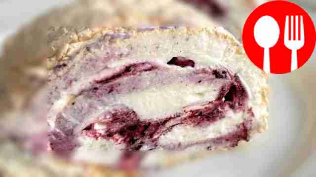 Meringue roll with a little sugar and berry layer