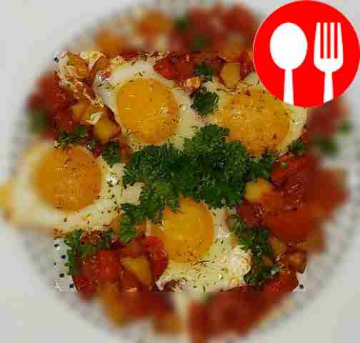 Serve the finished fried eggs hot. Sprinkle...