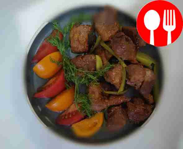 Fried meat with cucumber strips