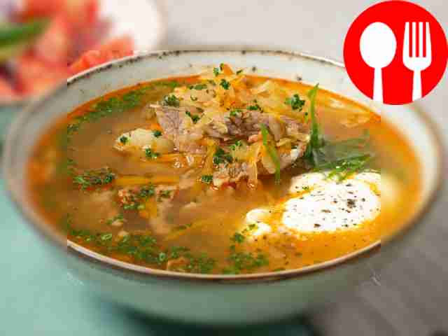 Cabbage soup with beef and bacon in the oven