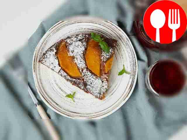 Cut the finished pie with mango slices into...