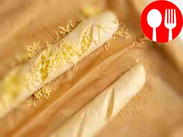 Bake the baguettes. Sprinkle the pieces with...