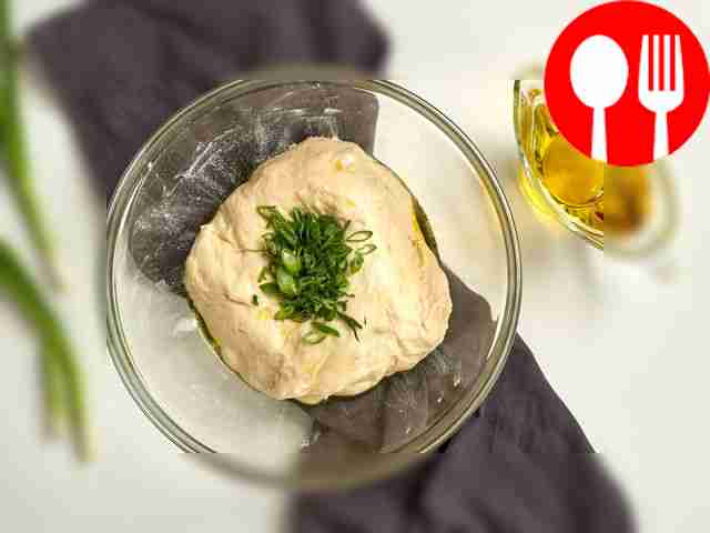 Knead the dough. Finely chop the green onions....