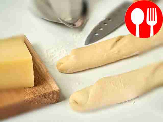 Form baguettes. Place the dough on a table...