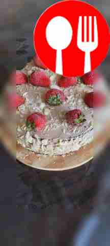 Cake in a frying pan with strawberries