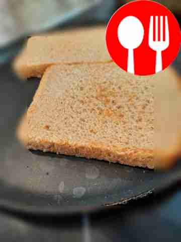 Dry the bread slices in a dry frying pan.
