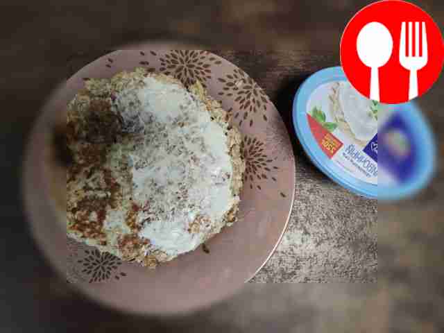 Spread half of the pancake with cream cheese.