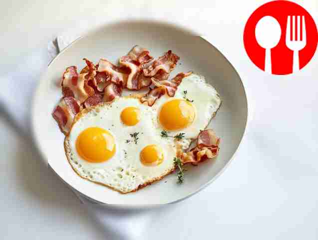 Fried egg with quail eggs, bacon and herbs