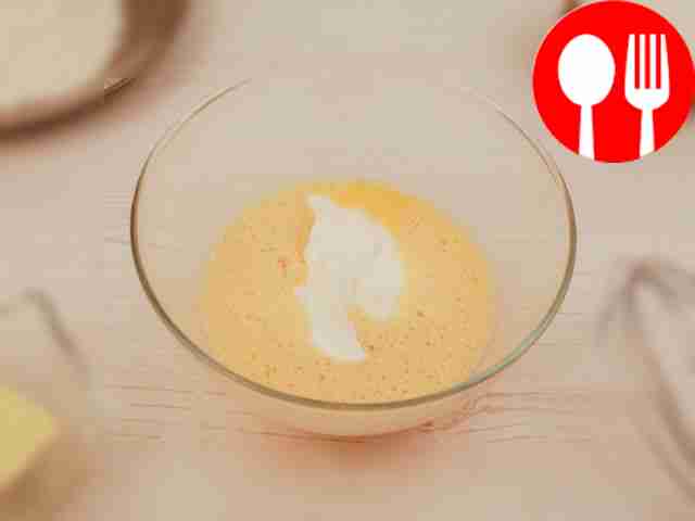 Add sour cream to the eggs.