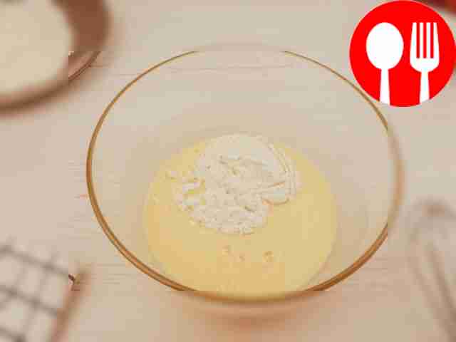 Add sifted flour to the bowl.