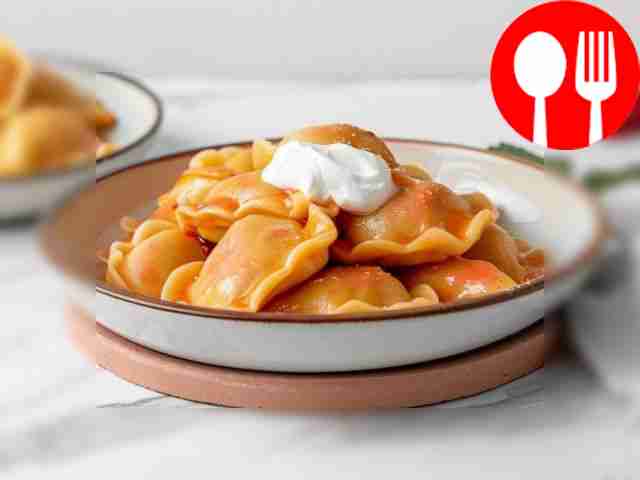 Homemade dumplings with sweet and sour redcurrant filling