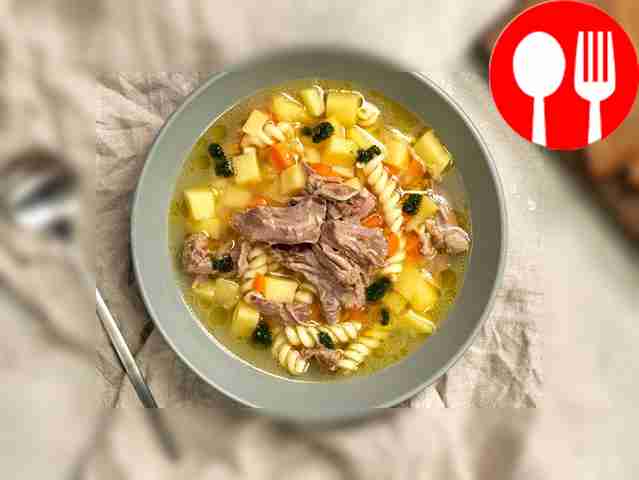 Serve turkey neck soup, garnished with parsley.