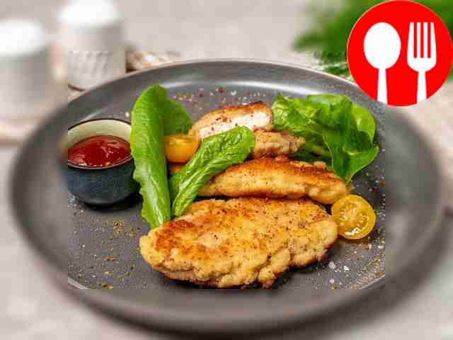 Chicken steak breaded with cheese and breadcrumbs
