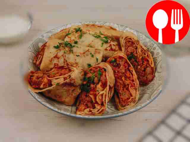 Pancakes with minced meat and tomato sauce