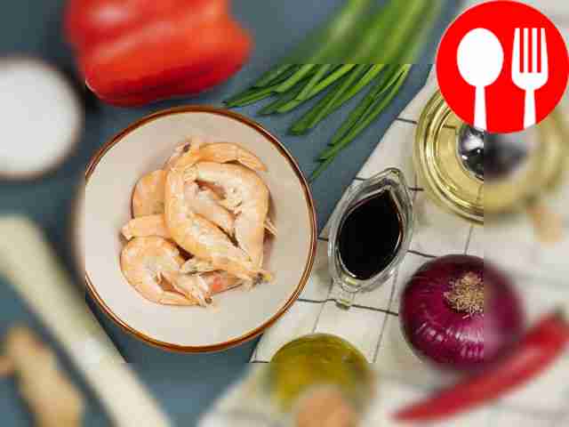 Prepare ingredients for shrimp ramen. Peel the...