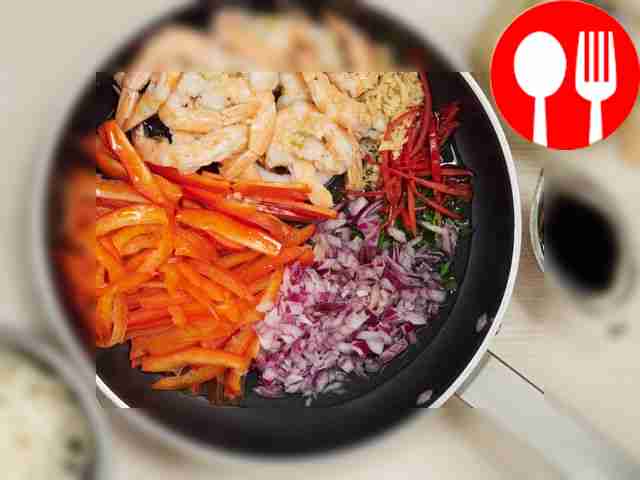 Prepare shrimp ramen. In a deep frying pan,...