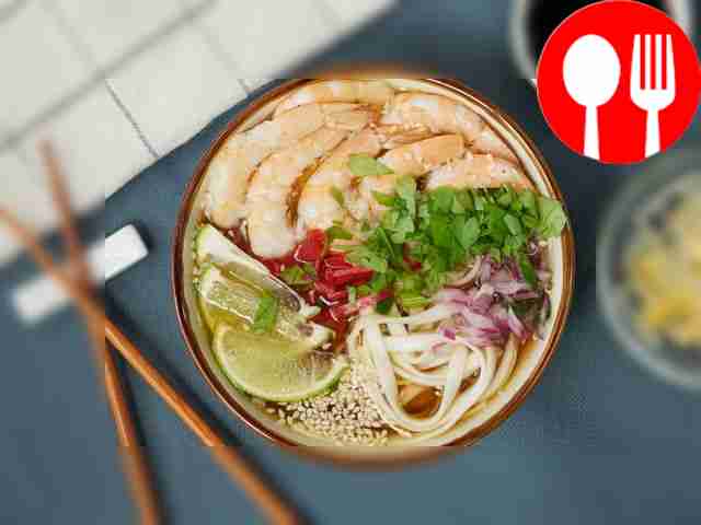 Place the finished ramen with shrimp on...