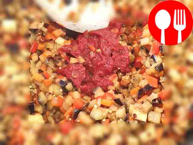 When the vegetables are soft, add tomato...