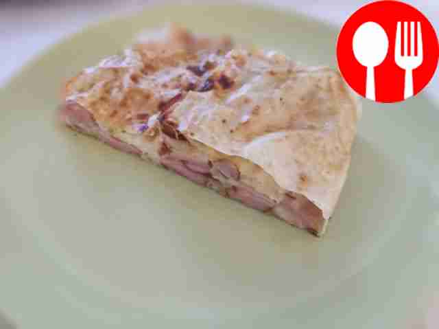 Spicy strudel with sausages and cheese in phyllo dough