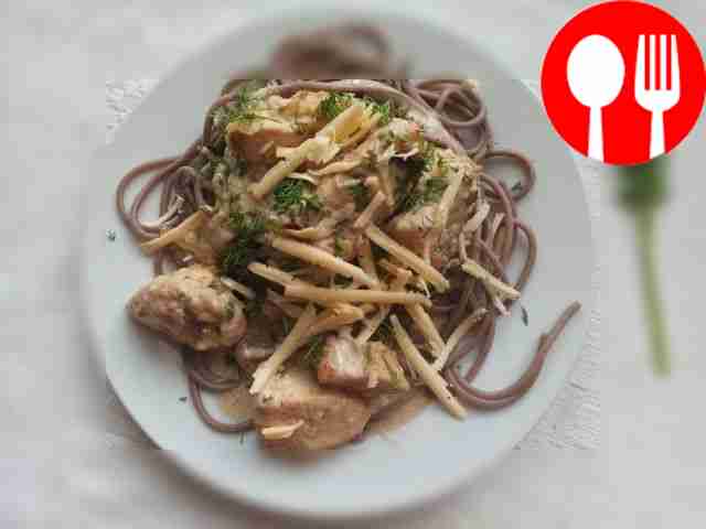 Serve the finished noodles on dishes, placing...