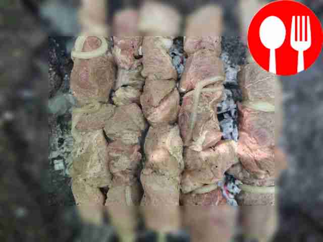 Place the marinated pieces of meat on a...