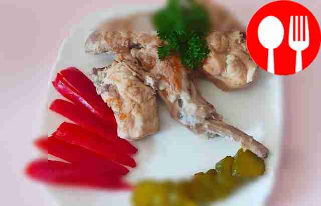 Juicy rabbit in sour cream and garlic sauce