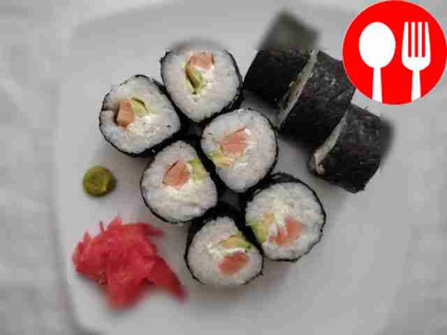 Sushi rolls with fish, avocado and cucumbers