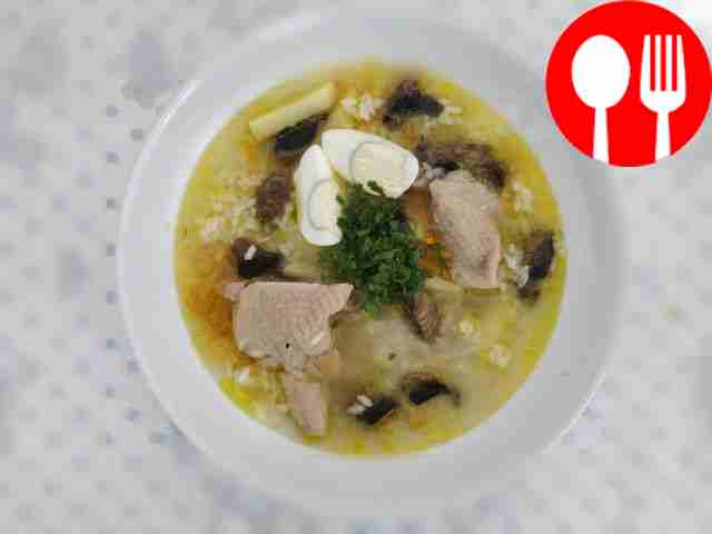 Homemade rice soup with chicken and mushrooms