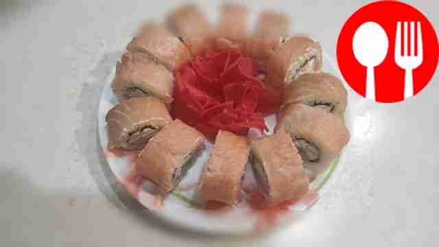 Homemade rolls with trout, crab sticks and cucumber