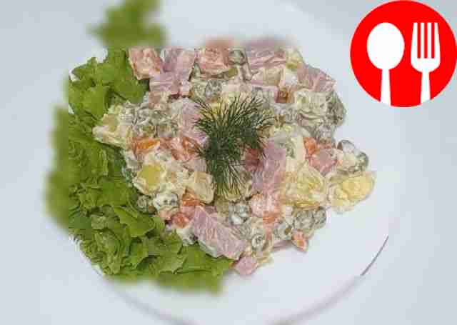 Winter salad with sausage, potatoes and vegetables