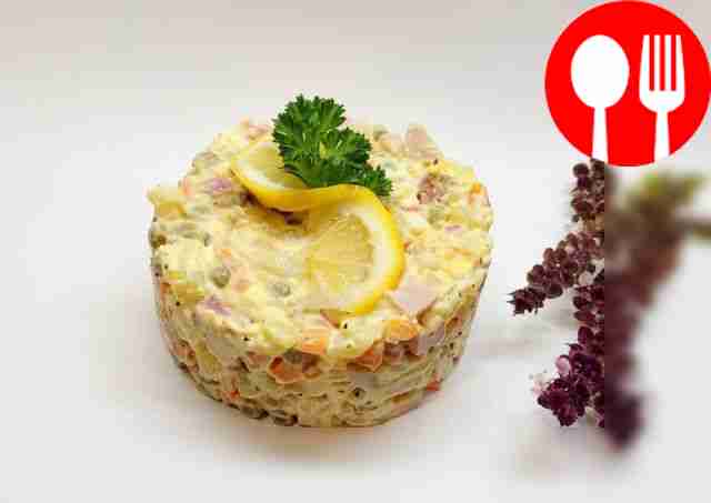 Spicy salad with sausage, eggs and vegetables