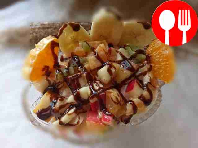 Tropical salad with bananas, kiwi and citruses