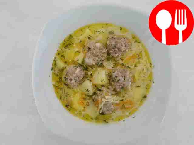 Cheese soup with noodles and meatballs