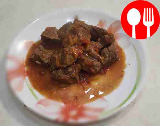 Veal goulash with vegetables in a slow cooker