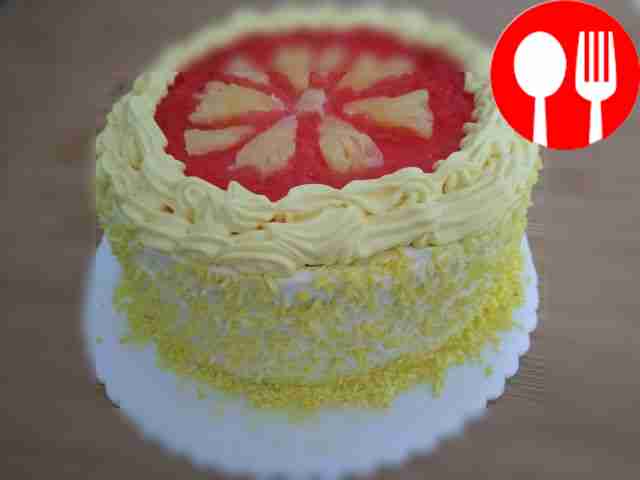 Bright birthday cake with pineapple pieces