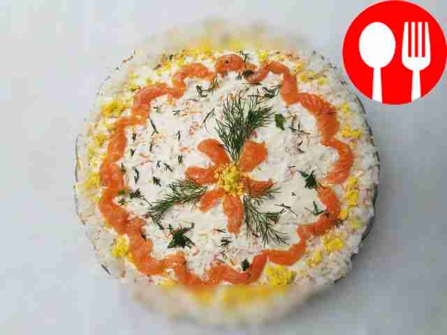 Layered salad with red fish, rice and vegetables