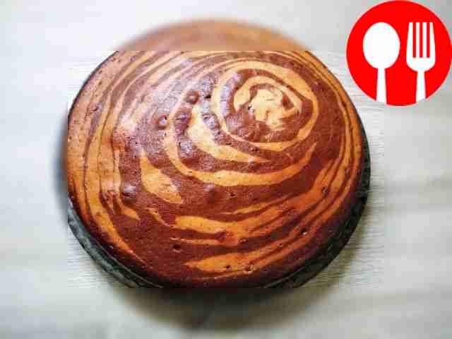 Place the finished pie on a wooden surface,...