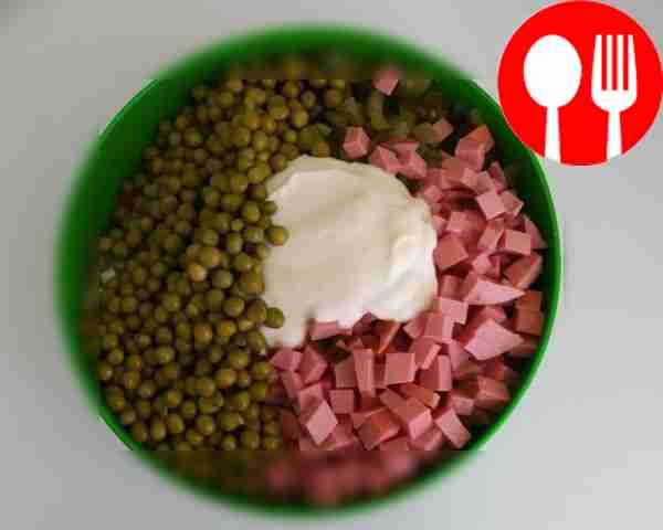 Dice the sausage and pickles. Add the peas,...