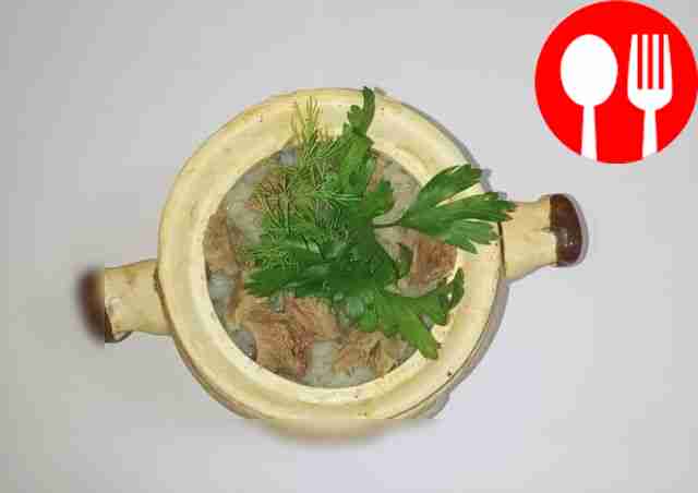 Juicy veal with rice in pots