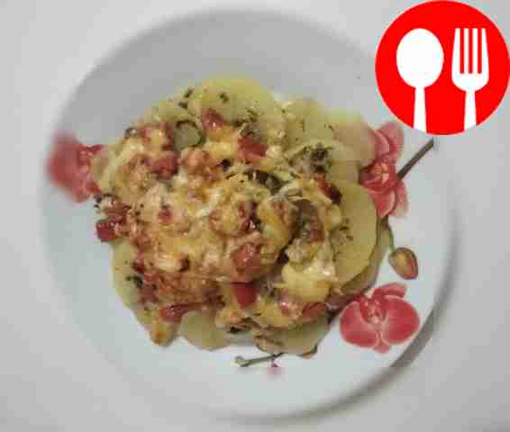 Pork baked with potatoes in the oven